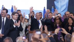 Benjamin Netanyahu, leader of the Likud party, center, waves at the party's headquarters in Jerusalem, Israel, on Wednesday, Nov. 2, 2022. Israelis began voting on Tuesday in their fifth general election since 2019, with former Prime Minister Netanyahu plotting his return as part of an alliance that could empower the nations far right. Photographer: Kobi Wolf/Bloomberg via Getty Images