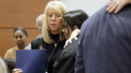 Annika Dworet, left, embraces Sam Fuentes, who was injured in the 2018 school shootings, after Fuentes gave her victim impact statement during the sentencing hearing for Marjory Stoneman Douglas High School shooter Nikolas Cruz at the Broward County Courthouse in Fort Lauderdale, Fla., on Wednesday, Nov. 2, 2022. Dworet's son, Nicholas, was killed, and their other son, Alexander, was injured. Cruz was sentenced to life in prison for murdering 17 people at Parkland's Marjory Stoneman Douglas High School more than four years ago. (Amy Beth Bennett/South Florida Sun Sentinel via AP, Pool)