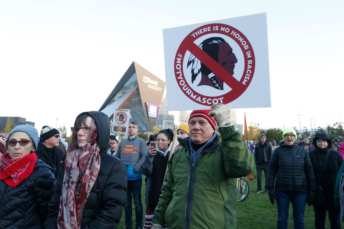 FILE - In this Oct. 24, 2019, file photo, Native American leaders protest against the Redskins team name outside U.S. Bank Stadium before an NFL football game between the Minnesota Vikings and the Washington Redskins in Minneapolis. A new name must still be selected for the Washington Redskins football team, one of the oldest and most storied teams in the National Football League, and it was unclear how soon that will happen. But for now, arguably the most polarizing name in North American professional sports is gone at a time of reckoning over racial injustice, iconography and racism in the U.S.