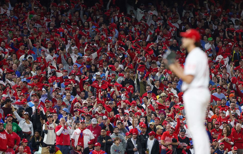 Fans wave towels as Philadelphia's Aaron Nola prepares to pitch during Game 4.