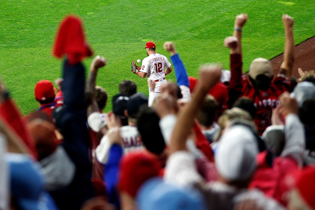 Fans react as Kyle Schwarber of the Phillies makes a catch for an out on Wednesday.