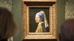 Visitors looks at the Johannes Vermeer's painting "Girl with a Pearl Earring" at the Mauritshuis museum in The Hague.