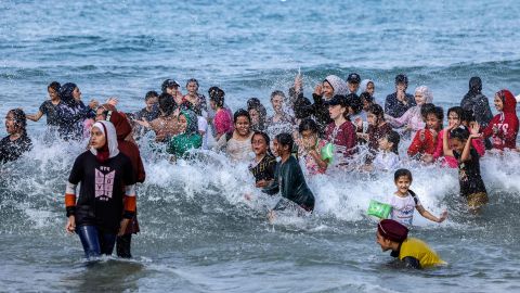 Palestinian girls take part in a swimming festival organized by the Gaza Swimming Academy in the Mediterranean Sea off Beit Lahia in the northern Gaza Strip on Thursday.  