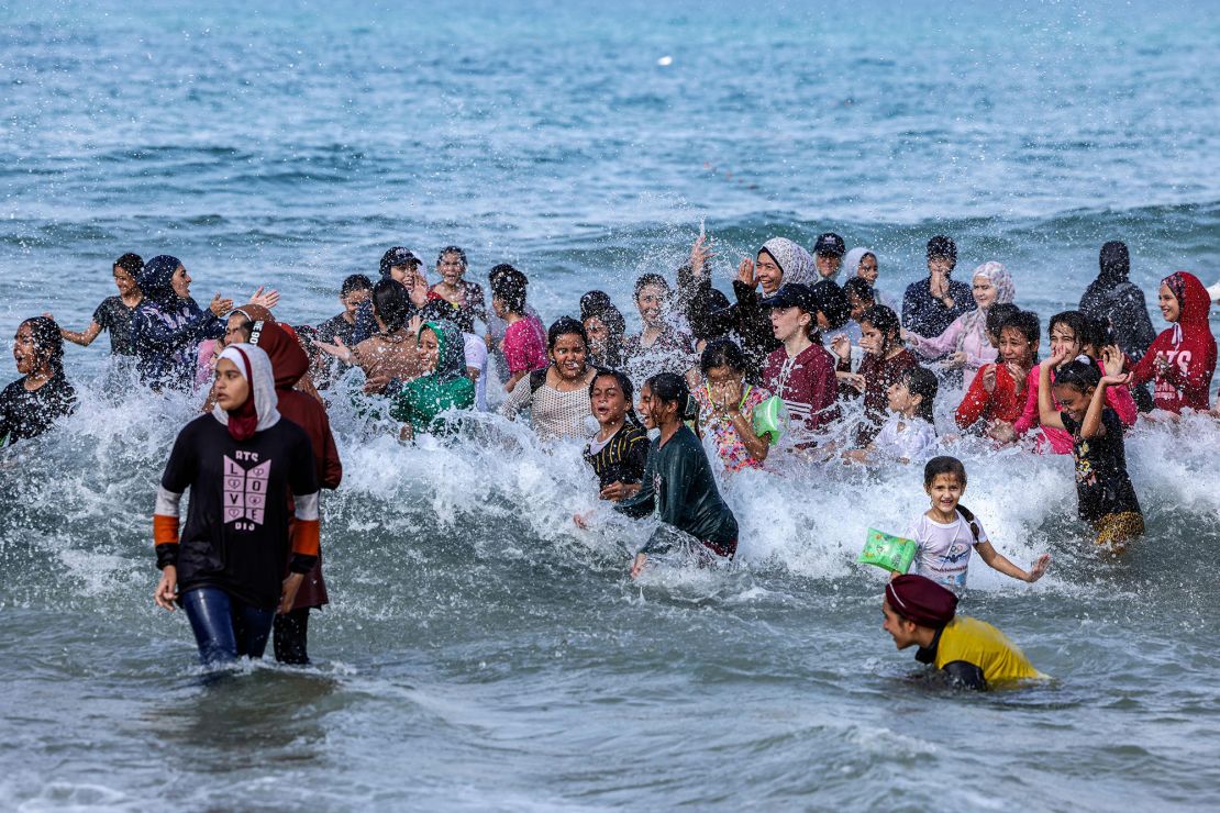 Palestinian girls take part in a swimming festival organized by the Gaza Swimming Academy in the Mediterranean Sea off Beit Lahia in the northern Gaza Strip on Thursday.  