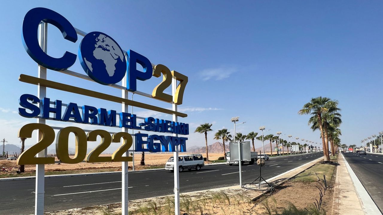 View of a COP27 sign on the road leading to the conference area in Egypt's Red Sea resort town of Sharm el-Sheikh, taken on October 22, as it prepares to host the COP27 summit.