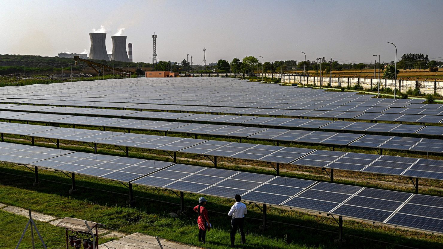 While India's renewable energy sector is rapidly increasing, the country remains largely reliant on coal. Here, solar panels are seen at the National Thermal Power Corporation (NTPC) plant, which is primarily coal-fired. 
