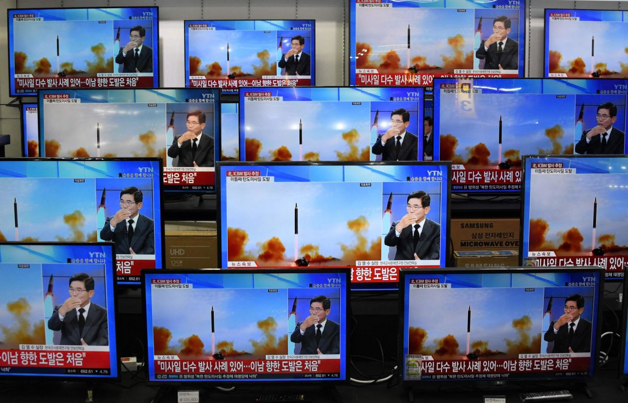 Television screens in an electronic market in Seoul show a news report about the latest North Korean missile launch with file footage on Thursday, November 3.