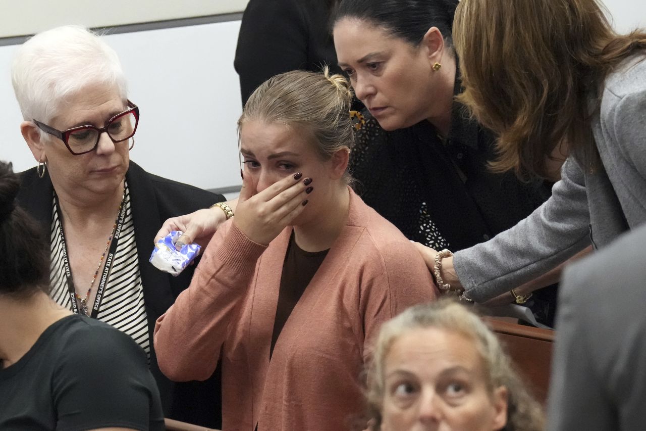 Meghan Petty is comforted as she takes a break from giving her victim impact statement during the sentencing hearing for Parkland school shooter Nikolas Cruz at the Broward County Courthouse in Fort Lauderdale, Florida, on Tuesday, November 1. Cruz has been formally sentenced to life in prison without the possibility of parole. Petty's sister, Alaina, was killed in the 2018 shooting at Marjory Stoneman Douglas High School.