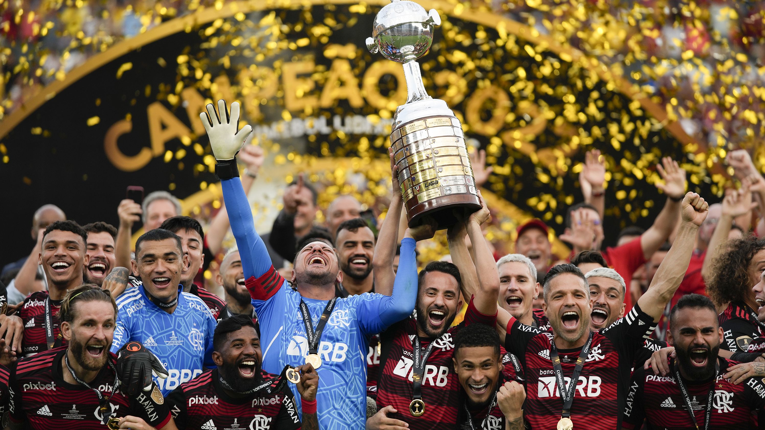 Brazil's Flamengo team celebrates with the trophy after winning the final Copa Libertadores soccer match against Brazil's Athletico Paranaense in Guayaquil, Ecuador, on Saturday, October 29.