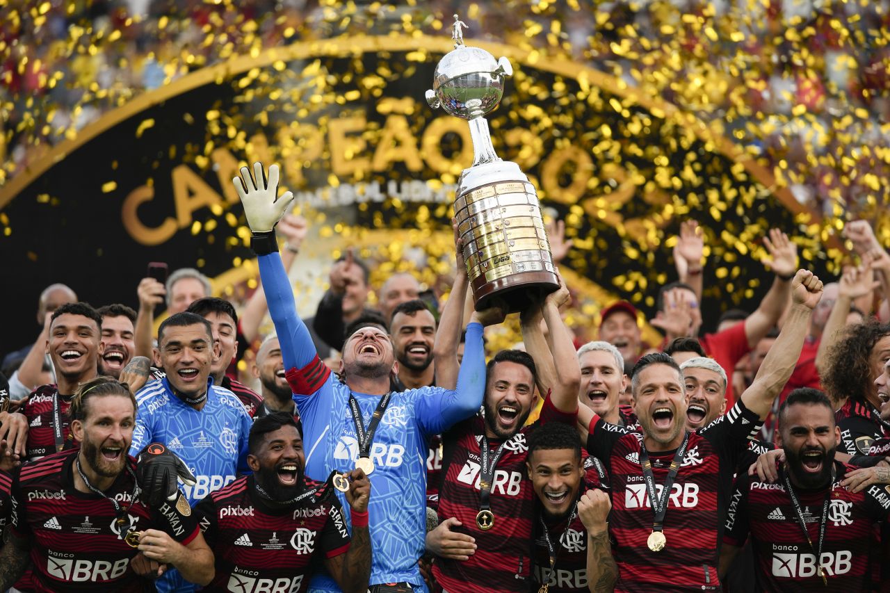 Brazil's Flamengo team celebrates with the trophy after winning the final Copa Libertadores soccer match against Brazil's Athletico Paranaense in Guayaquil, Ecuador, on Saturday, October 29.