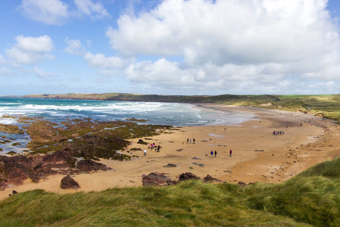 The grave dedicated to Dobby lies on the Freshwater West beach in Pembrokeshire, Wales.