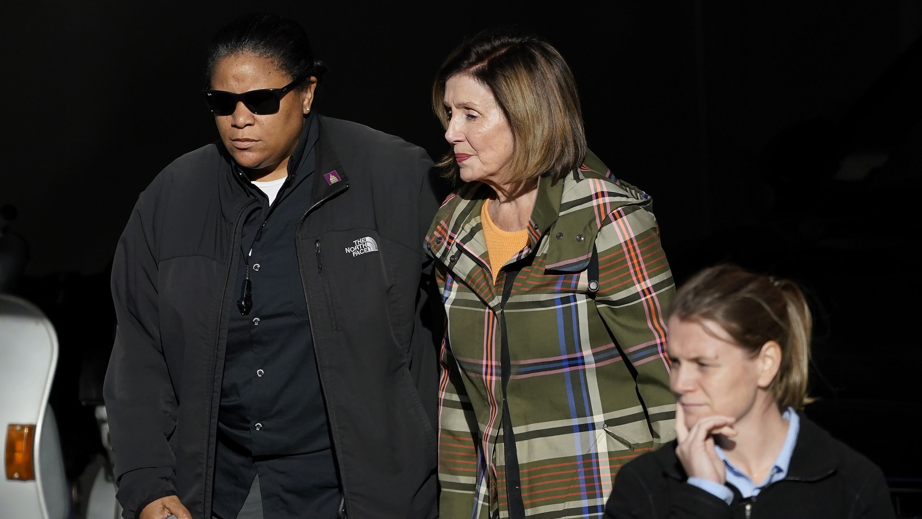 House Speaker Nancy Pelosi is escorted to a vehicle outside of her home in San Francisco on Wednesday, November 2. Pelosi's husband, Paul, was <a href="https://www.cnn.com/politics/live-news/nancy-pelosi-husband-paul-attack/index.html" target="_blank">attacked with a hammer</a> at the couple's home on October 28.