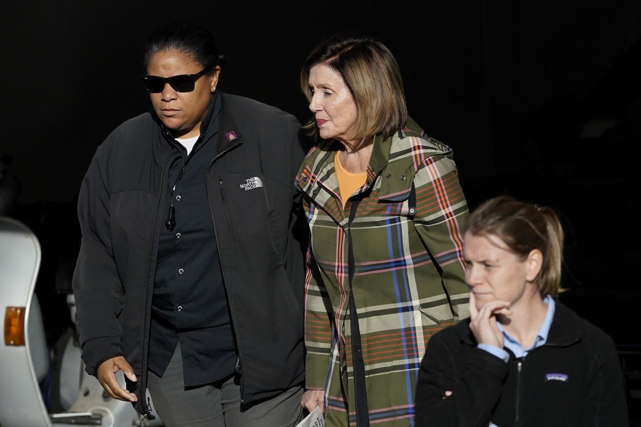 House Speaker Nancy Pelosi is escorted to a vehicle outside of her home in San Francisco on Wednesday, November 2. Pelosi's husband, Paul, was <a href="https://www.cnn.com/politics/live-news/nancy-pelosi-husband-paul-attack/index.html" target="_blank">attacked with a hammer</a> at the couple's home on October 28.