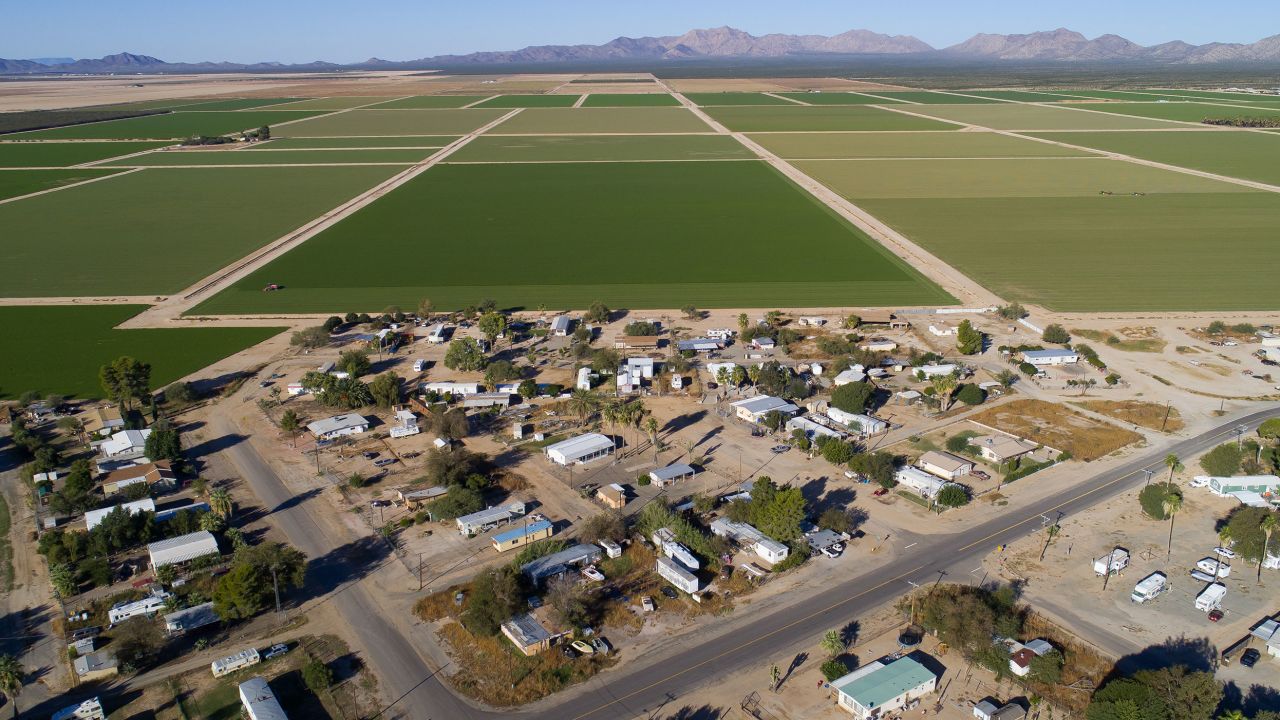 The sprawling alfalfa fields of Al Dahra Farms dwarf the town of Wenden, Arizona.