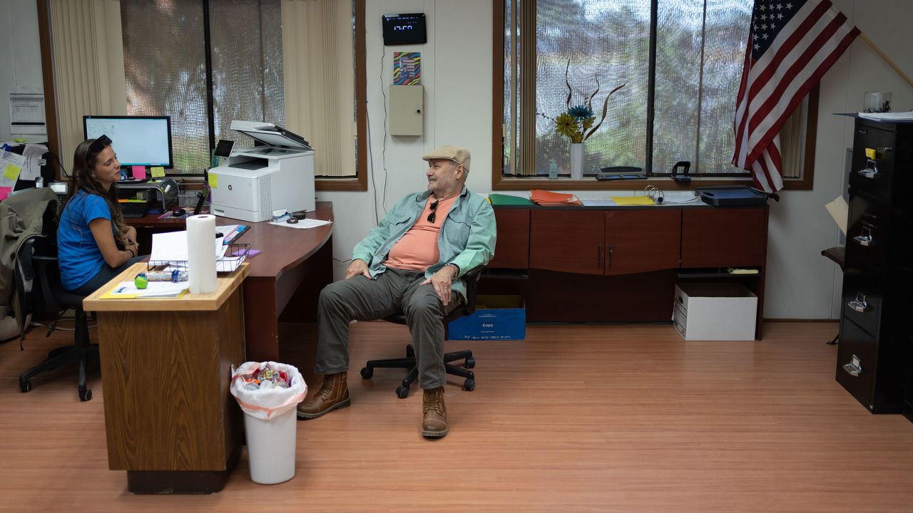 Office manager Brianna Davis, left, chats with manager Gary Saiter, right, at Wenden Domestic Water Improvement District.