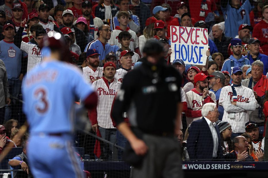 A Phillies fan holds up a sign referencing designated hitter Bryce Harper on Thursday.
