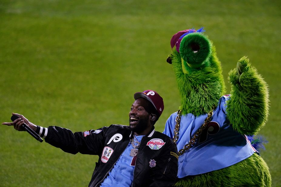 Rapper Meek Mill, a Philadelphia native, performs alongside the Phillie Phanatic before Game 5.