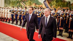 04 November 2022, China, Peking: German Chancellor Olaf Scholz (r, SPD) is received with military honors by Li Keqiang, Premier of the People's Republic of China, in the North Hall of the Great Hall of the People. Scholz is traveling to China for his first visit as chancellor. The focus of the visit will include German-Chinese relations, economic cooperation, the Ukraine conflict and the Taiwan issue. Photo: Kay Nietfeld/dpa (Photo by Kay Nietfeld/picture alliance via Getty Images)