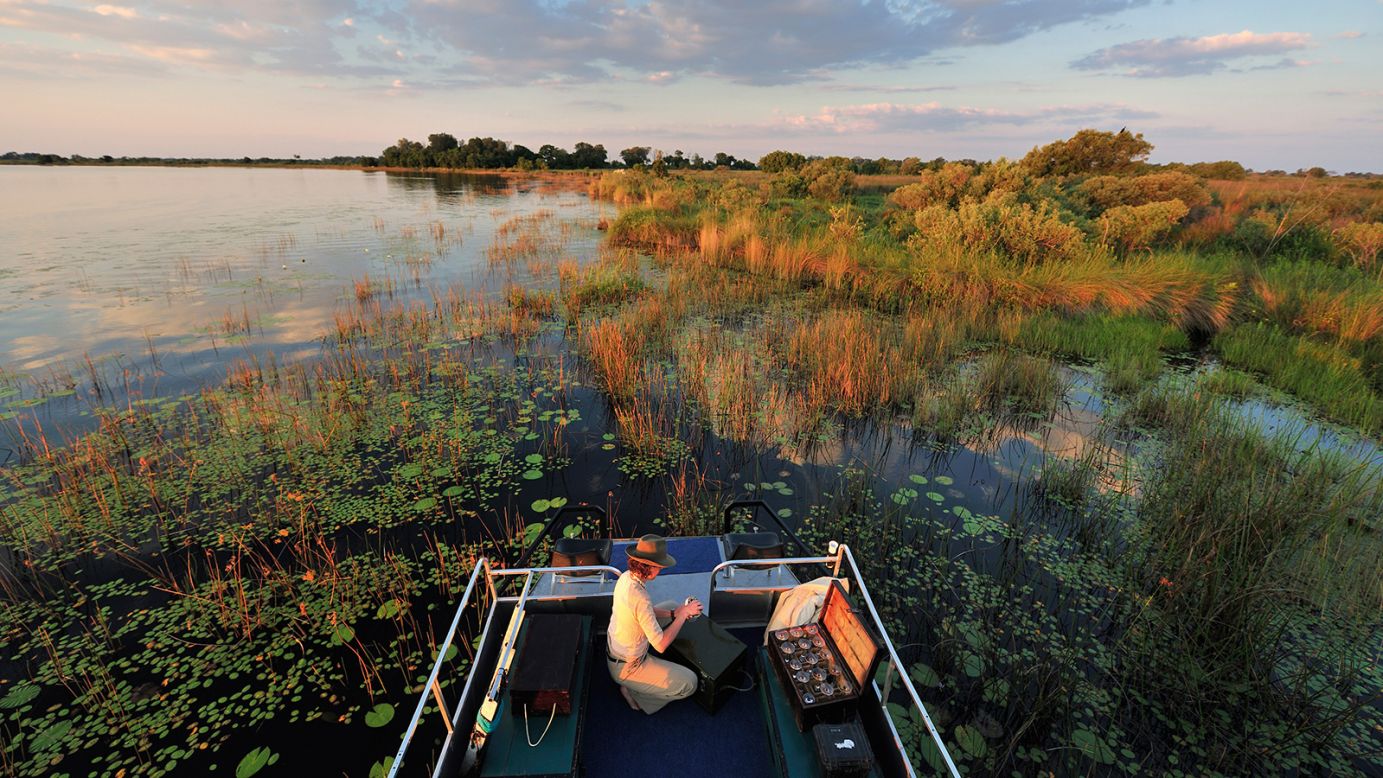 <strong>Okavango Delta:</strong> De Vleeschauwer's book also chronicles a boat safari and the incredible watery landscape of the Okavango Delta in Botswana.