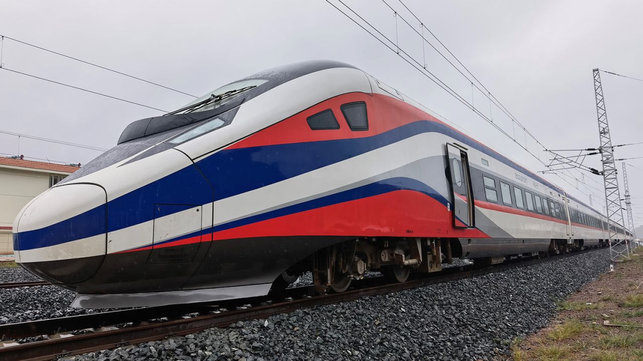 The new train features white, red and blue stripes -- the colors of the Laotian flag. 
