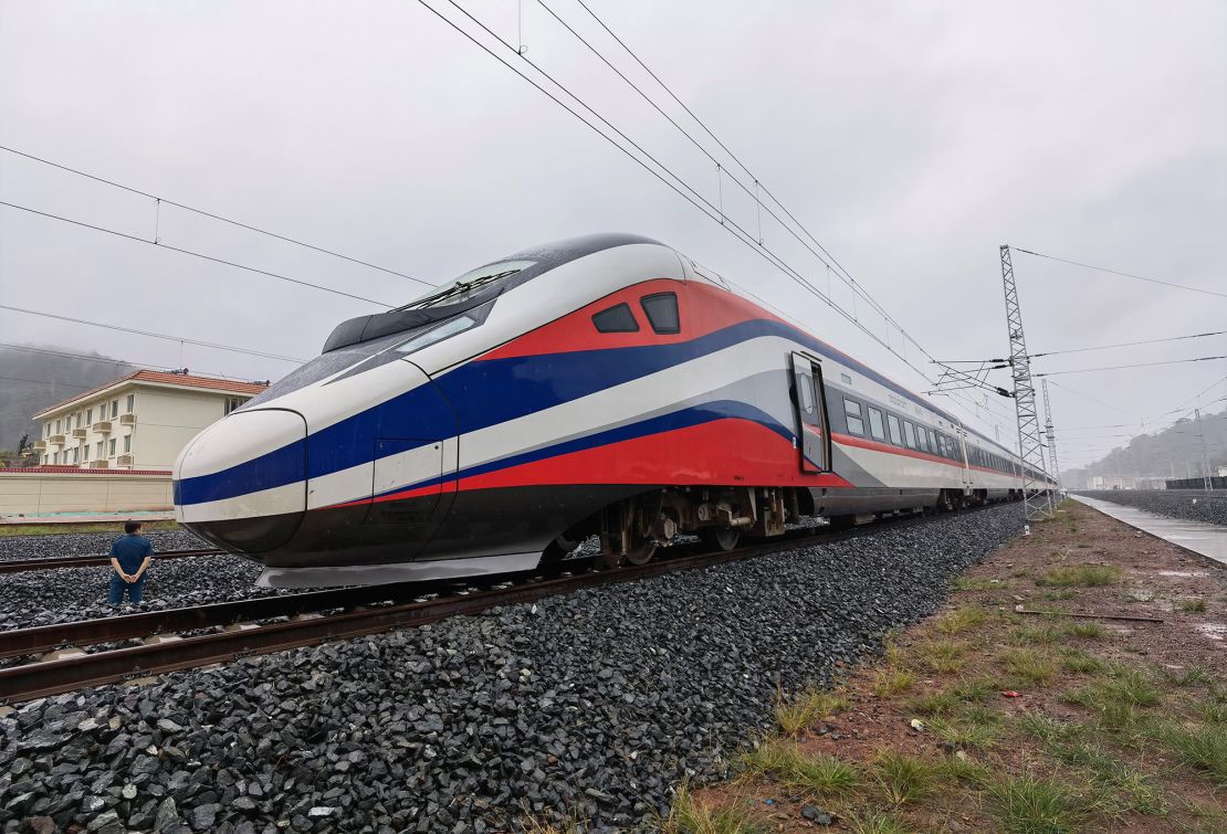 The new train features white, red and blue stripes -- the colors of the Laotian flag. 