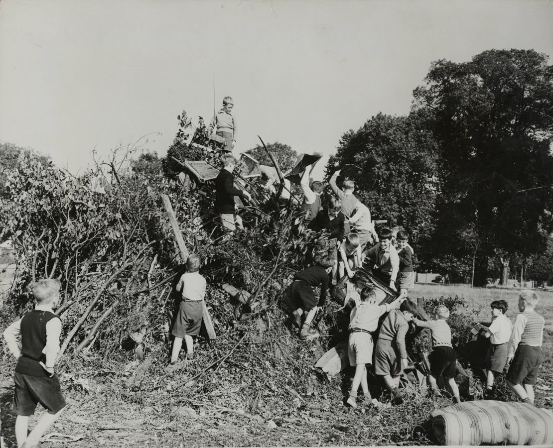 A photograph from 1955, depicting children at a school in Surrey, England, preparing the Guy Fawkes Night bonfire.