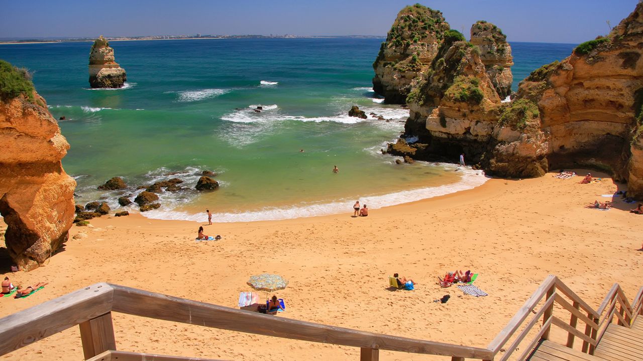 The Algarve in Portugal's south, where Ponta da Piedade beach in Lagos is pictured, is a popular destination for visitors and transplants.