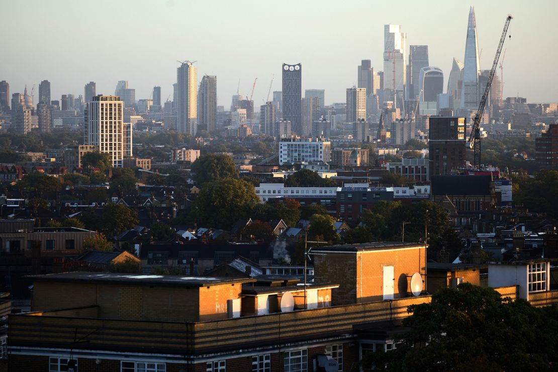 London's financial district can be seen in the distance beyond housing developments on October 8, 2022. 