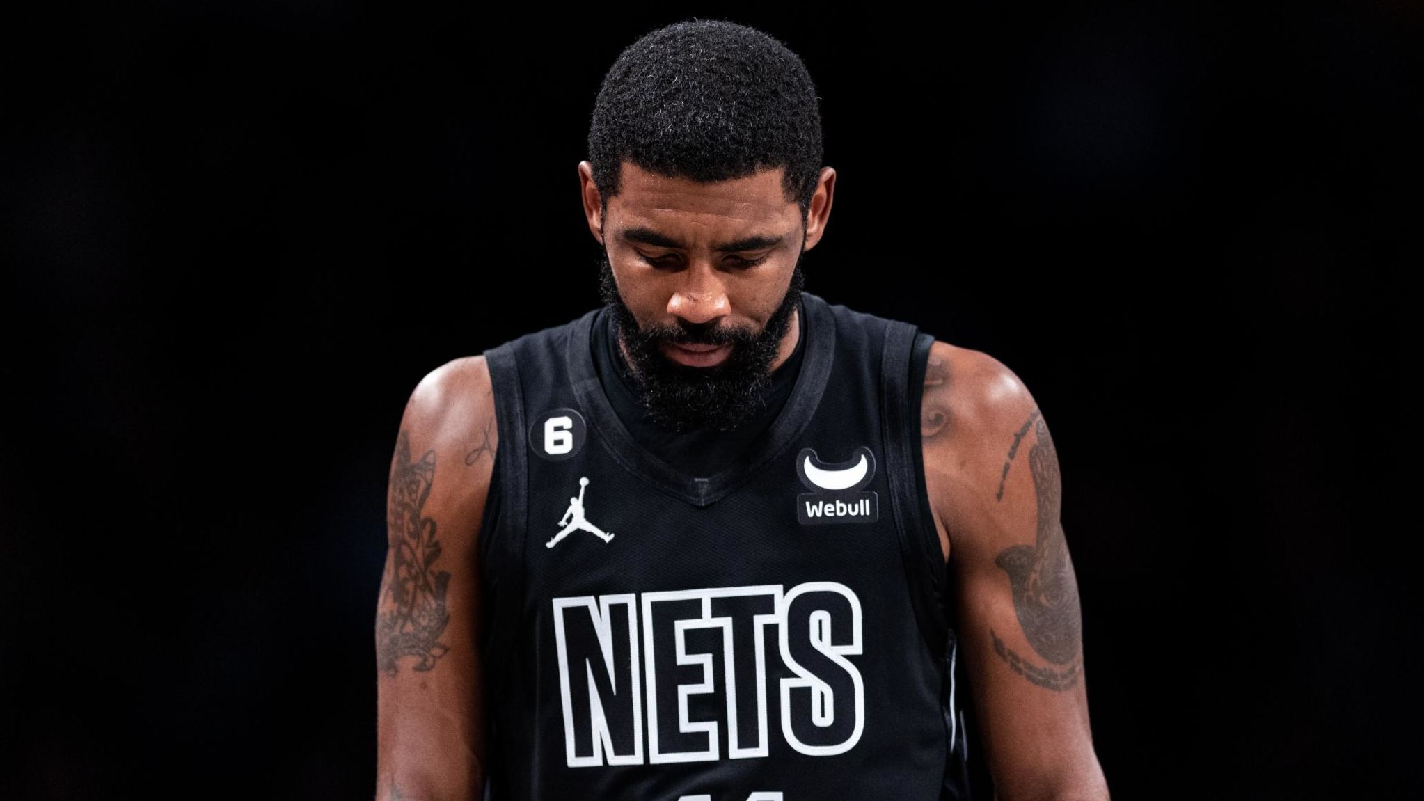 Irving walks to the bench during the second quarter of the game against the Indiana Pacers at Barclays Center on October 31, 2022.