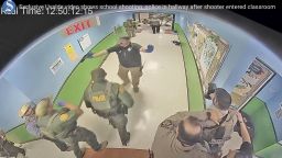 FILE - In this photo from surveillance video provided by the Uvalde Consolidated Independent School District via the Austin American-Statesman, authorities respond to the shooting at Robb Elementary School in Uvalde, Texas, Tuesday, May 24, 2022. This week's release of the striking video showing police inaction during the Uvalde school shooting provoked one unexpected response — anger toward the two Texas news outlets, even though their scoop provided what many in the community were seeking. The Austin American-Statesman and KVUE-TV faced complaints of insensitivity toward families of the 19 children and two adults killed by a gunman at Robb elementary school on May 24. (Uvalde Consolidated Independent School District/Austin American-Statesman via AP, File)