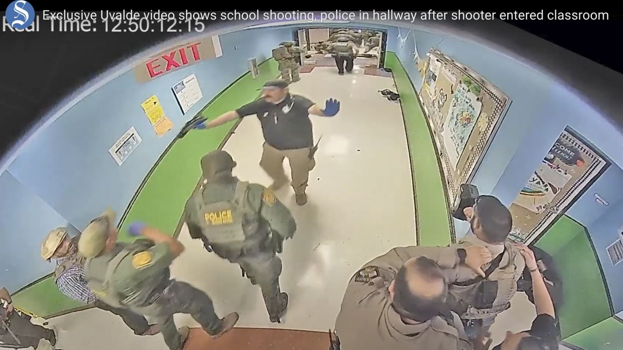 FILE - In this photo from surveillance video provided by the Uvalde Consolidated Independent School District via the Austin American-Statesman, authorities respond to the shooting at Robb Elementary School in Uvalde, Texas, Tuesday, May 24, 2022. This week's release of the striking video showing police inaction during the Uvalde school shooting provoked one unexpected response — anger toward the two Texas news outlets, even though their scoop provided what many in the community were seeking. The Austin American-Statesman and KVUE-TV faced complaints of insensitivity toward families of the 19 children and two adults killed by a gunman at Robb elementary school on May 24. (Uvalde Consolidated Independent School District/Austin American-Statesman via AP, File)