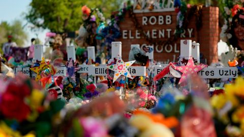 A makeshift memorial honoring those recently killed is formed around Robb Elementary School on July 10, 2022, in Uvalde, Texas.