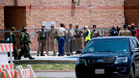 How the law enforcement response to the Uvalde massacre unfolded as children made chilling 911 calls from inside | CNN - breaking news now Law enforcement officers stand outside Robb Elementary School during the May 24 siege.