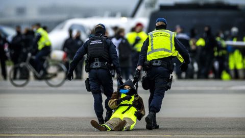 Hundreds of climate protesters held a large demonstration and blocked a runway at Schiphol Airport in the Netherlands on Saturday.