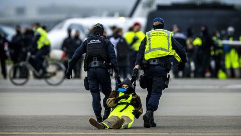 Hundreds of climate protesters staged a large-scale protest and blocked a runway at Schiphol airport in the Netherlands on Saturday.