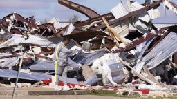 Adela Cox looks at the Trinity Baptist Church that was destroyed by a tornado in Idabel, Okla., Saturday, Nov. 5, 2022.