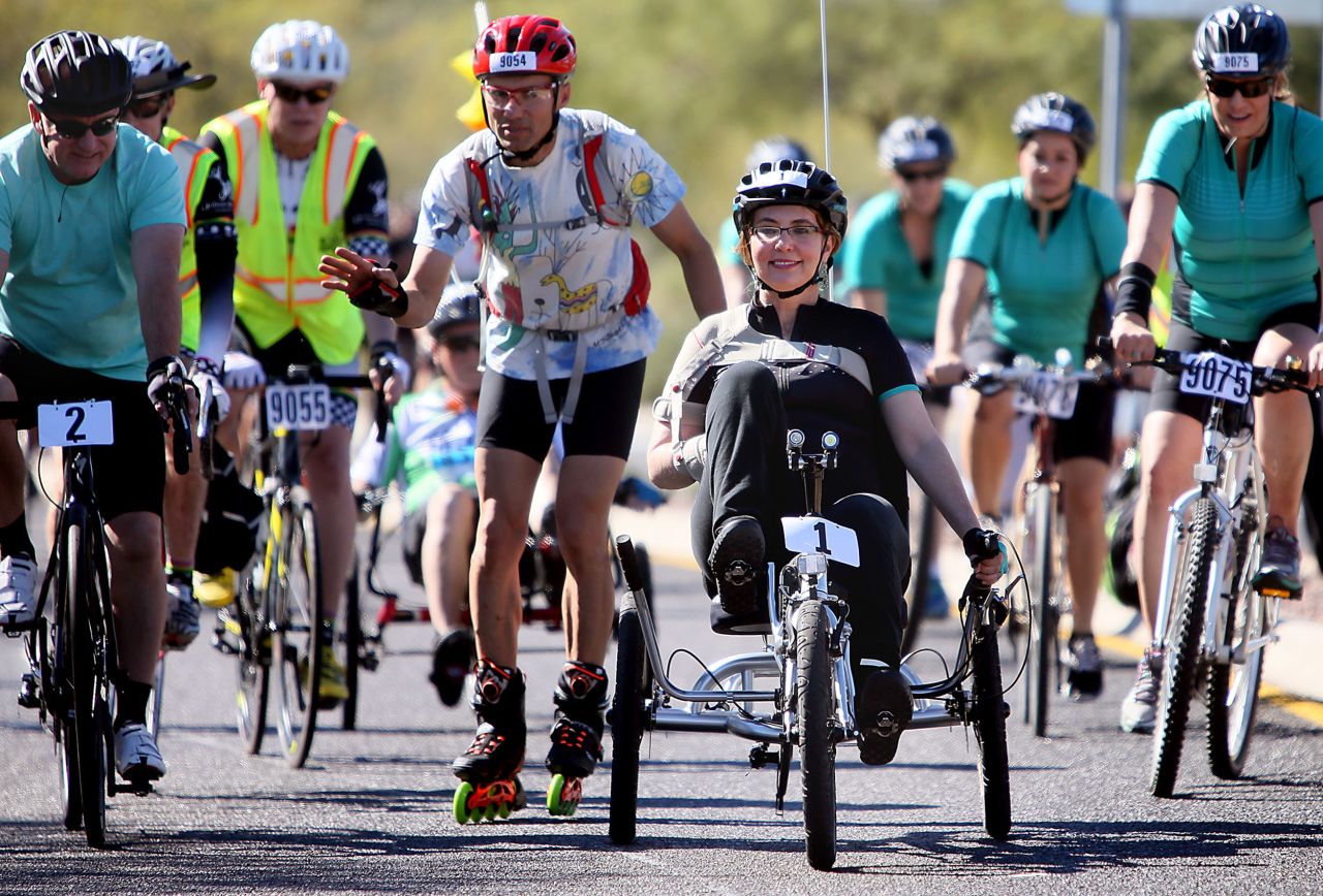 Giffords rides in a charity bike race in Tucson in November 2015.