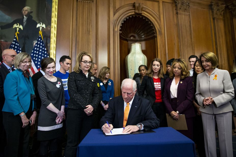 Giffords watches US Rep. Mike Thompson sign a 2019 bill that would expand background checks for sales of firearms. It did not make it through the Senate.