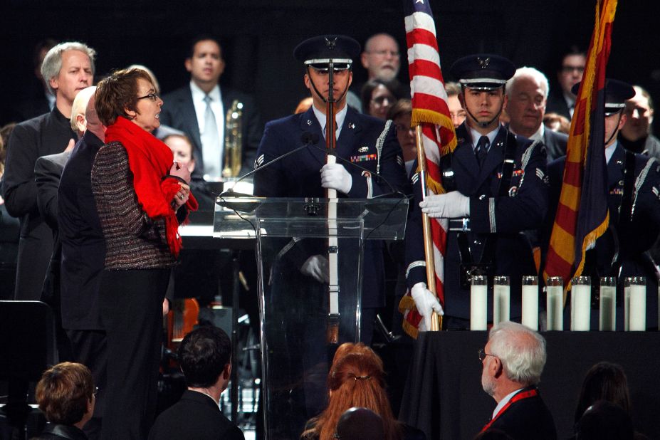 Giffords leads the Pledge of Allegiance during a vigil held on the one-year anniversary of the shooting.