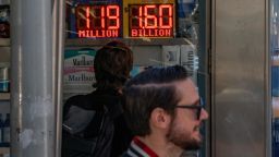 A person looks at a digital billboard advertising Powerball's Jackpot of 1.6 billion dollars in New York City, U.S., November 4, 2022. REUTERS/David 'Dee' Delgado