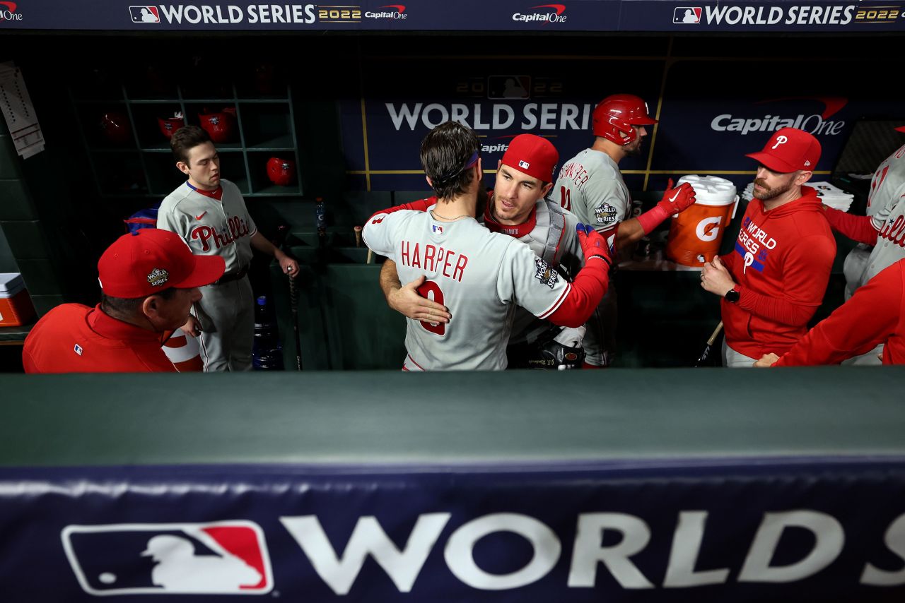 Bryce Harper and J.T. Realmuto of the Philadelphia Phillies get ready in the dugout prior to Game 6.