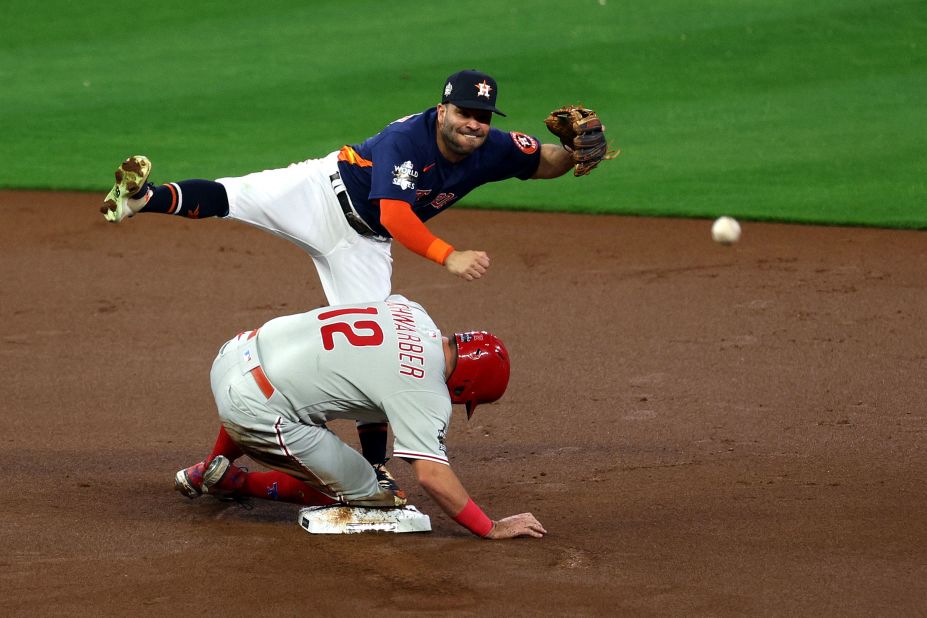 Astros second baseman Jose Altuve turns a double play in the first inning of Saturday's game.