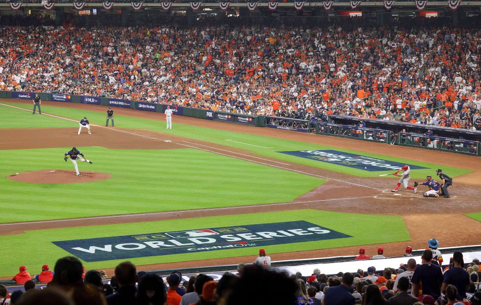 Philadelphia outfielder Kyle Schwarber sends a solo home run into the right field seats during Game 6 on Saturday. The home run briefly gave the Phillies a 1-0 lead.