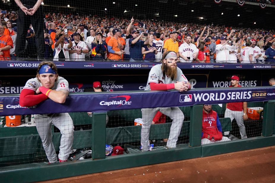 Phillies players watch the Astros celebrate.