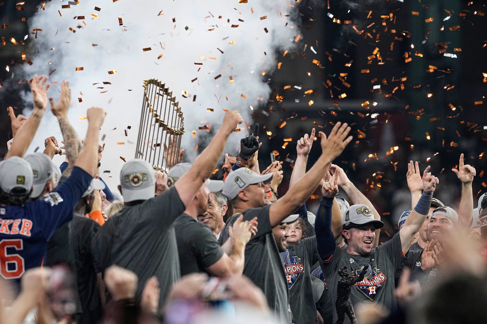 The Astros celebrate with the Commissioner's Trophy.