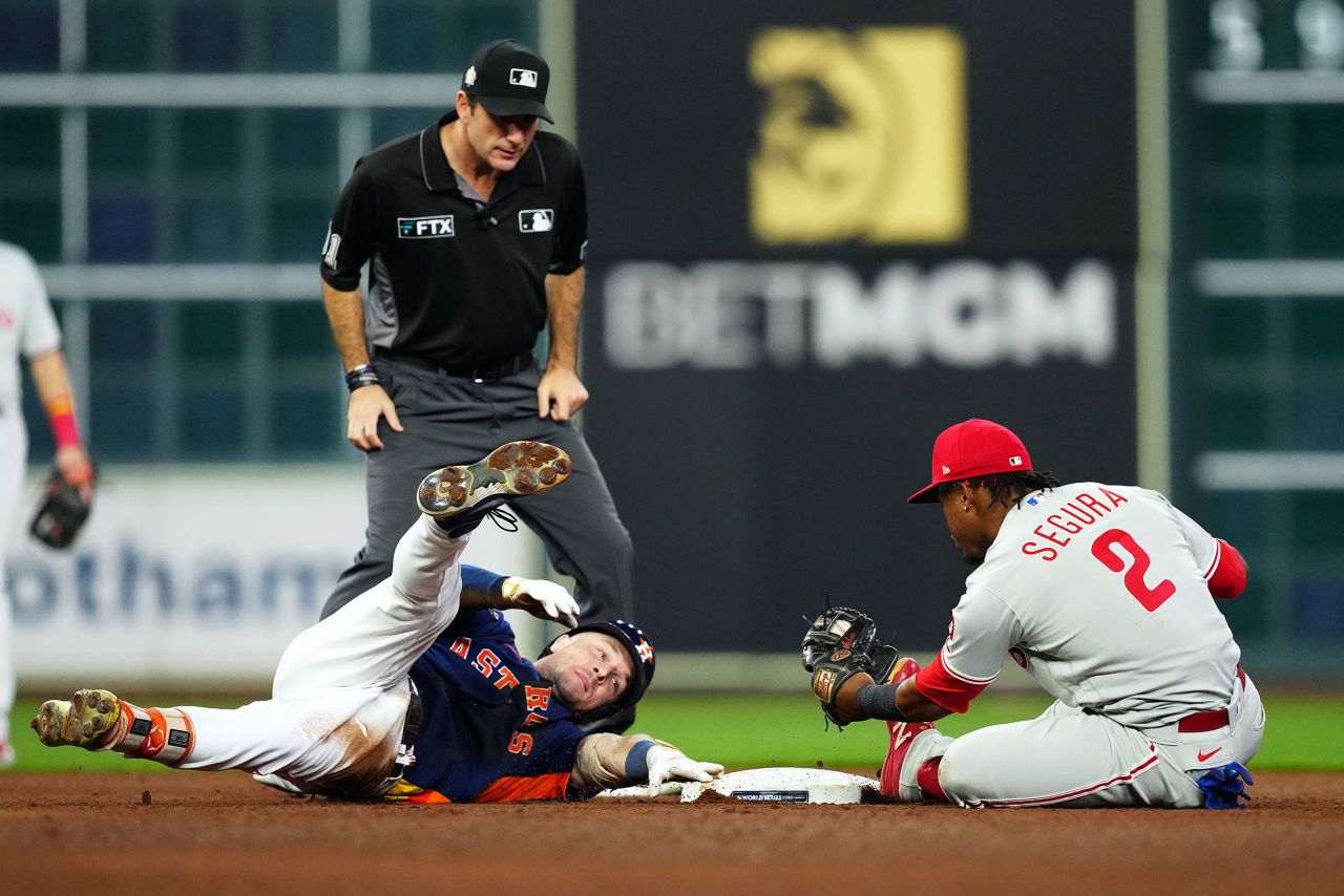 Houston infielder Alex Bregman is tagged out by Jean Segura while sliding into second base in the eighth inning of Saturday's game. Bregman was initially called safe on the play but the call was overturned after an official review.