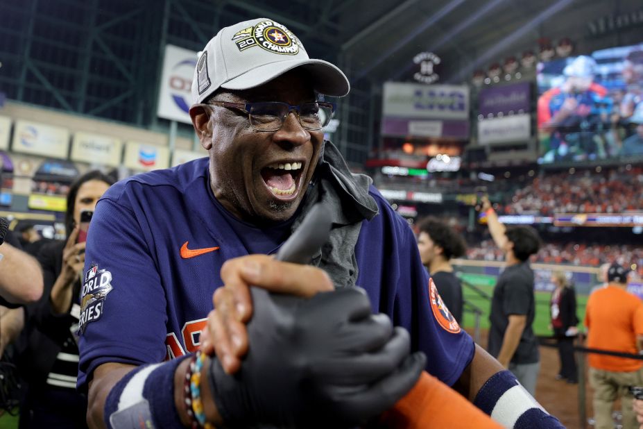 Houston manager Dusty Baker celebrates on the field after his team's victory on Saturday.