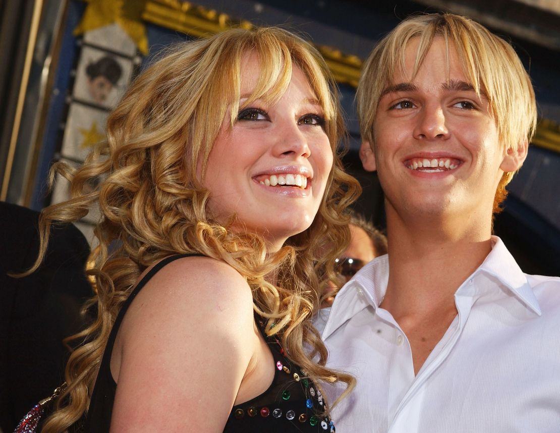 Actress Hilary Duff, left, hugs singer Aaron Carter as they attend the premiere of "The Lizzie McGuire Movie" on April 26, 2003, in Hollywood, California. 