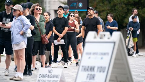 People wait in line on the final day of early voting at a polling location at Bank of America Stadium on November 5, 2022 in Charlotte, North Carolina. 