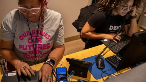 Kischea Talbert, left, works next to  Jones.